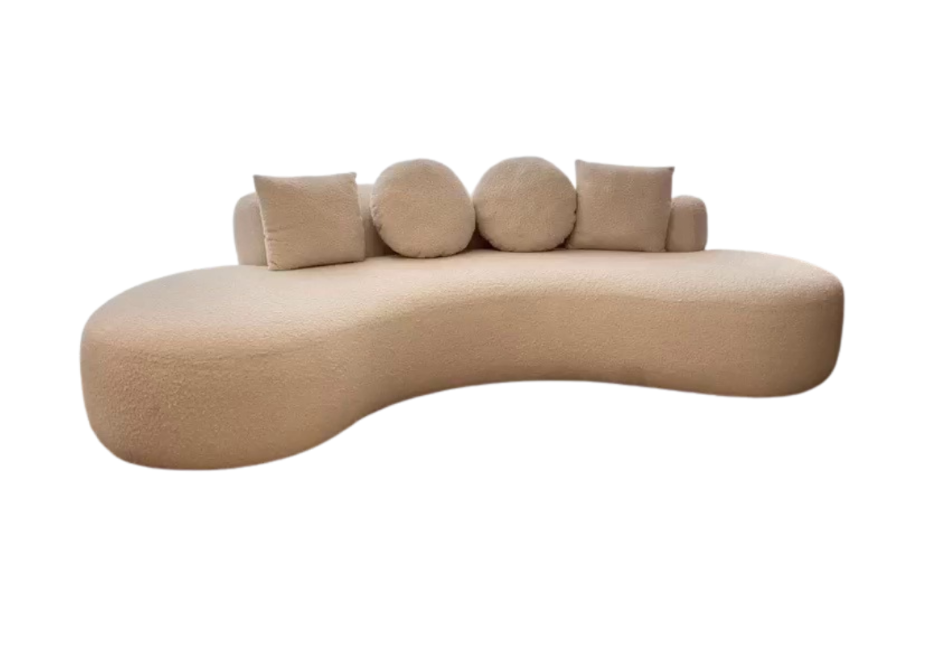 Beige, modern sofa with round cushions on a white background